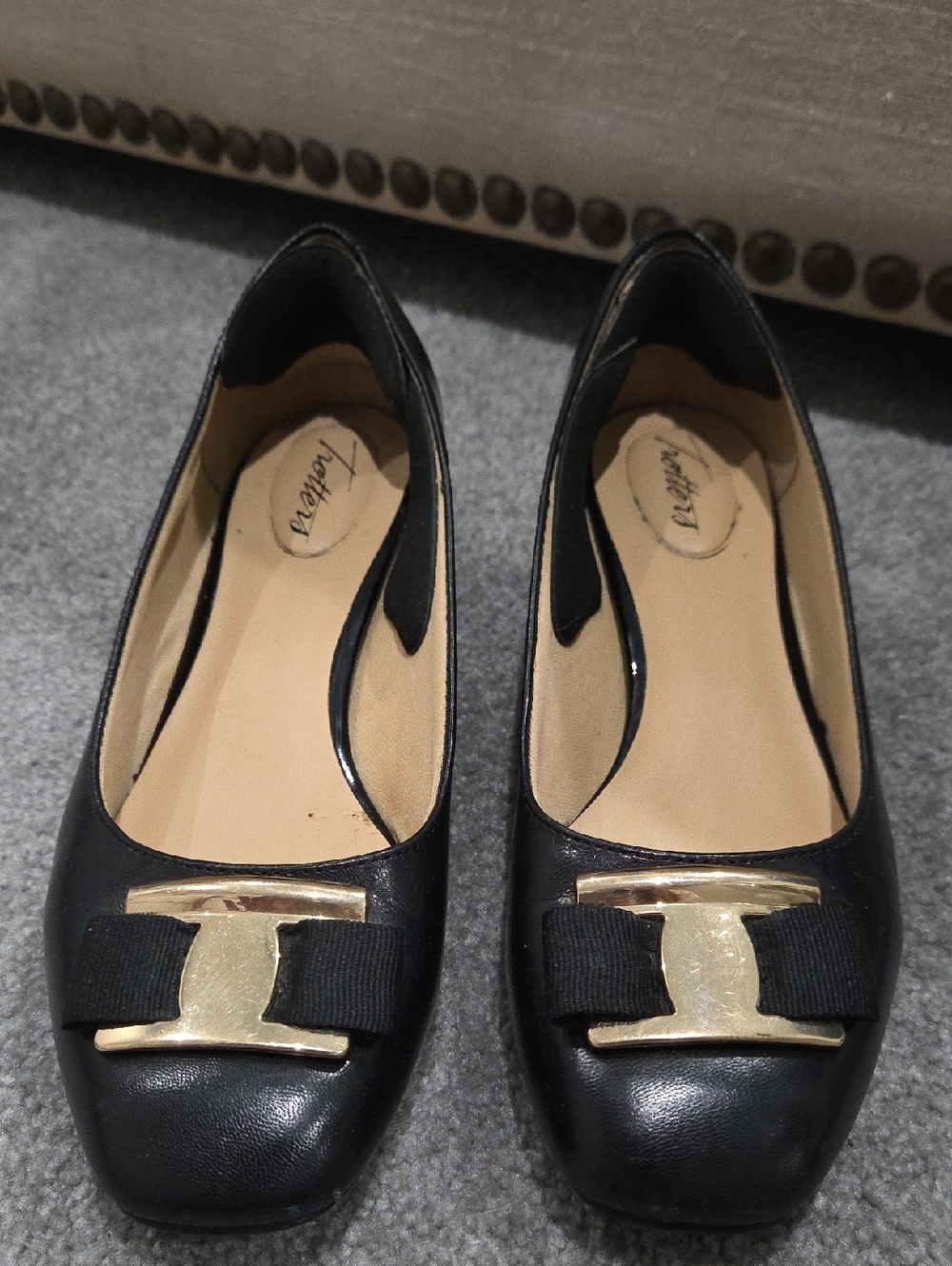 Black Leather Flat Chunky Heel Dress Shoe with Gold Bow Accent